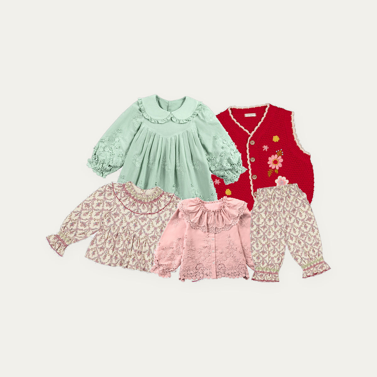 Happyology Lucky Bag, five autumn winter sample pieces laid out - embroidered dress, knitted vest, blouses and trousers